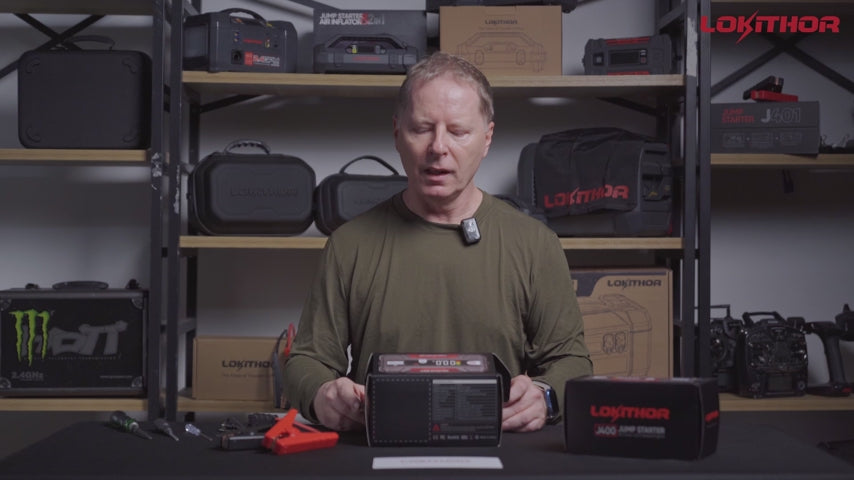 Person presenting LOKITHOR J400 Jump Starter with packaging